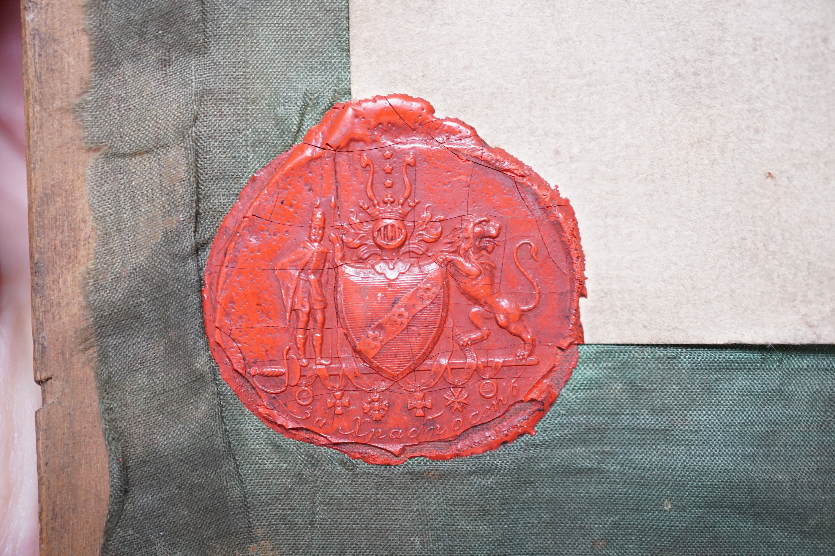 An early 20th century Russian Icon painted on wooden panel of Christ, with inscription and four seals reverse together with a later smaller Icon, largest 22.5cm wide x 27cm high